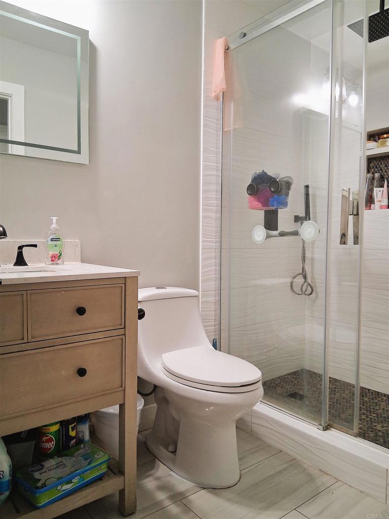 101 Lancer Avenue Oceanside, CA 92058 - Photo 7 of 17 a bathroom with a sink toilet and shower