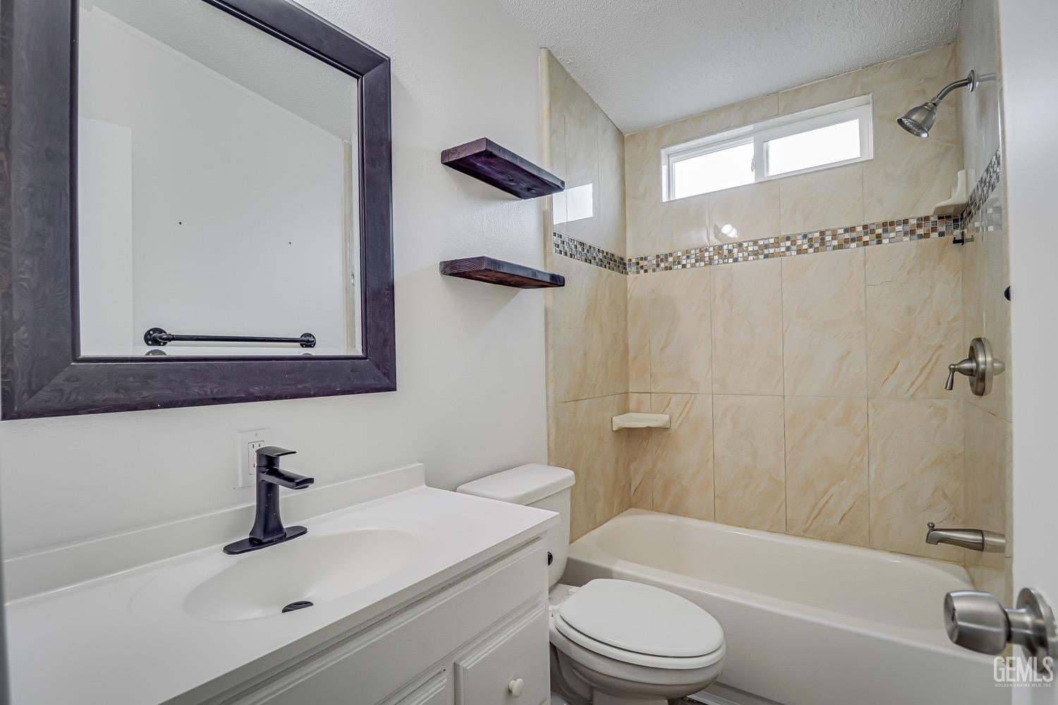 Undisclosed Address Bakersfield, CA 93314 - Photo 18 of 27 a bathroom with a sink toilet and shower