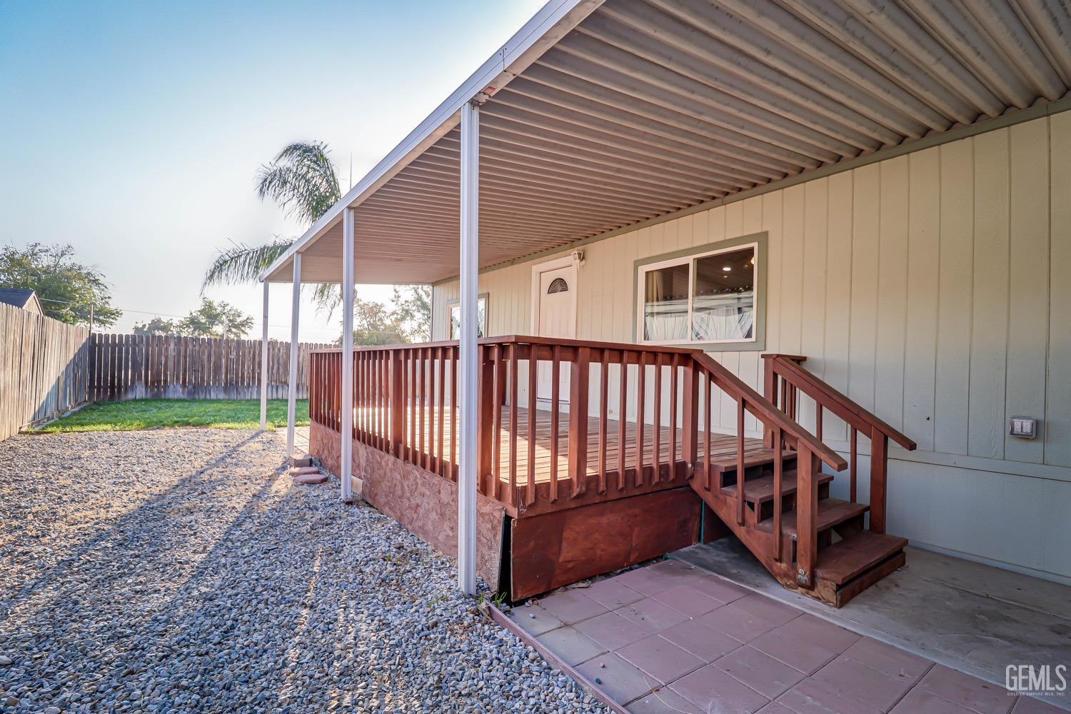 Undisclosed Address Bakersfield, CA 93314 - Photo 6 of 27 a view of a backyard with a deck