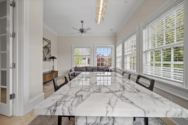 a view of a dining room with furniture window and outside view