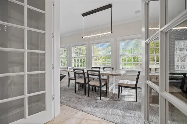 a spacious bedroom with a bed and a large window