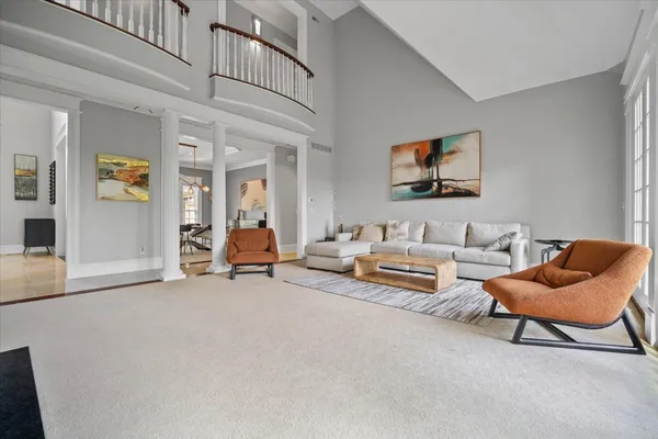 a view of a hallway with workspace and entryway