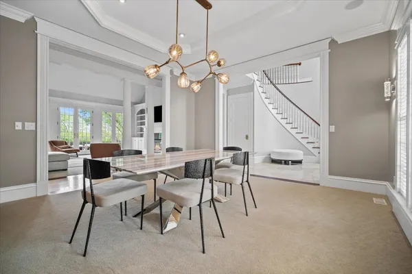 a view of a hallway with window and stairs