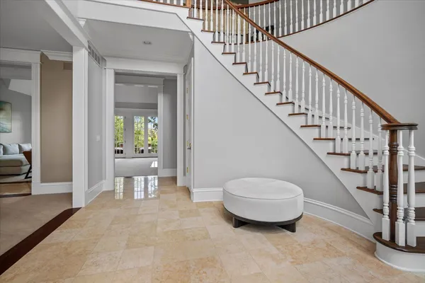 a bedroom with a large bed and a flat screen tv
