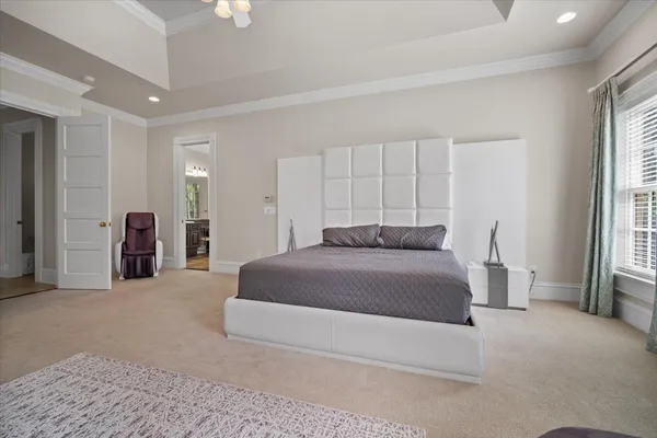 a bed room with a bed and a tv