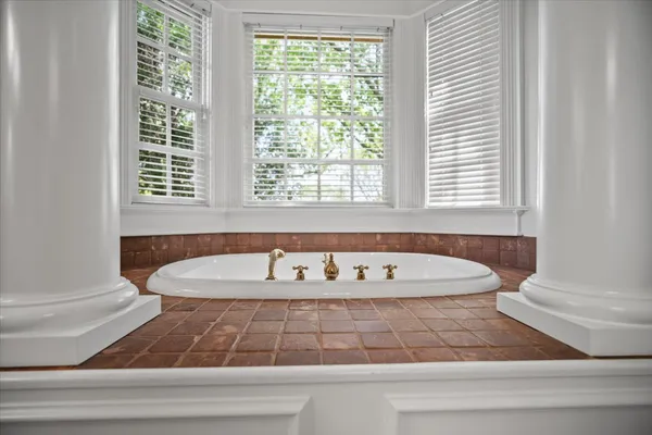 a bedroom with furniture and a flat screen tv