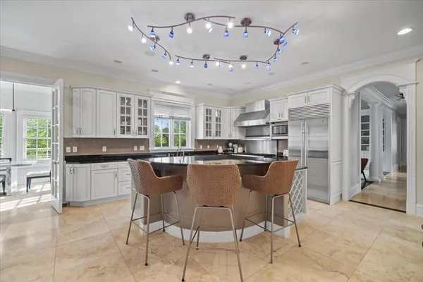 a kitchen with stainless steel appliances granite countertop a stove and a cabinets