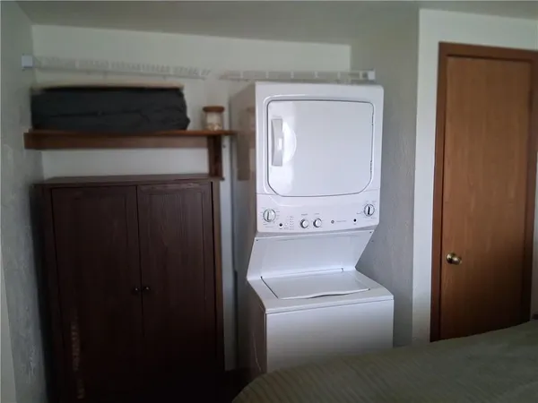 a bathroom with a sink toilet and mirror