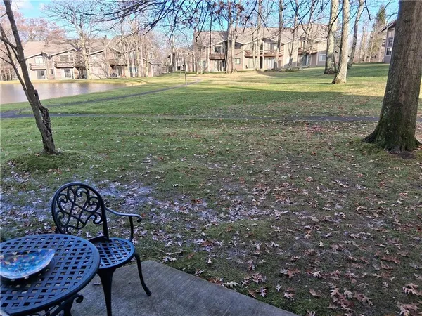 a view of a wooden deck and a yard