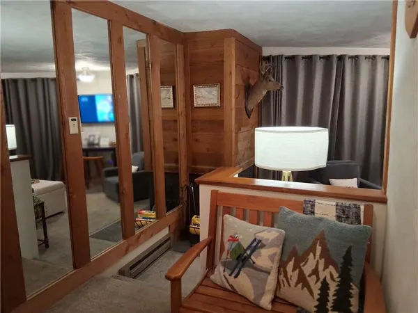 a room with furniture a flat screen tv and a view of living room