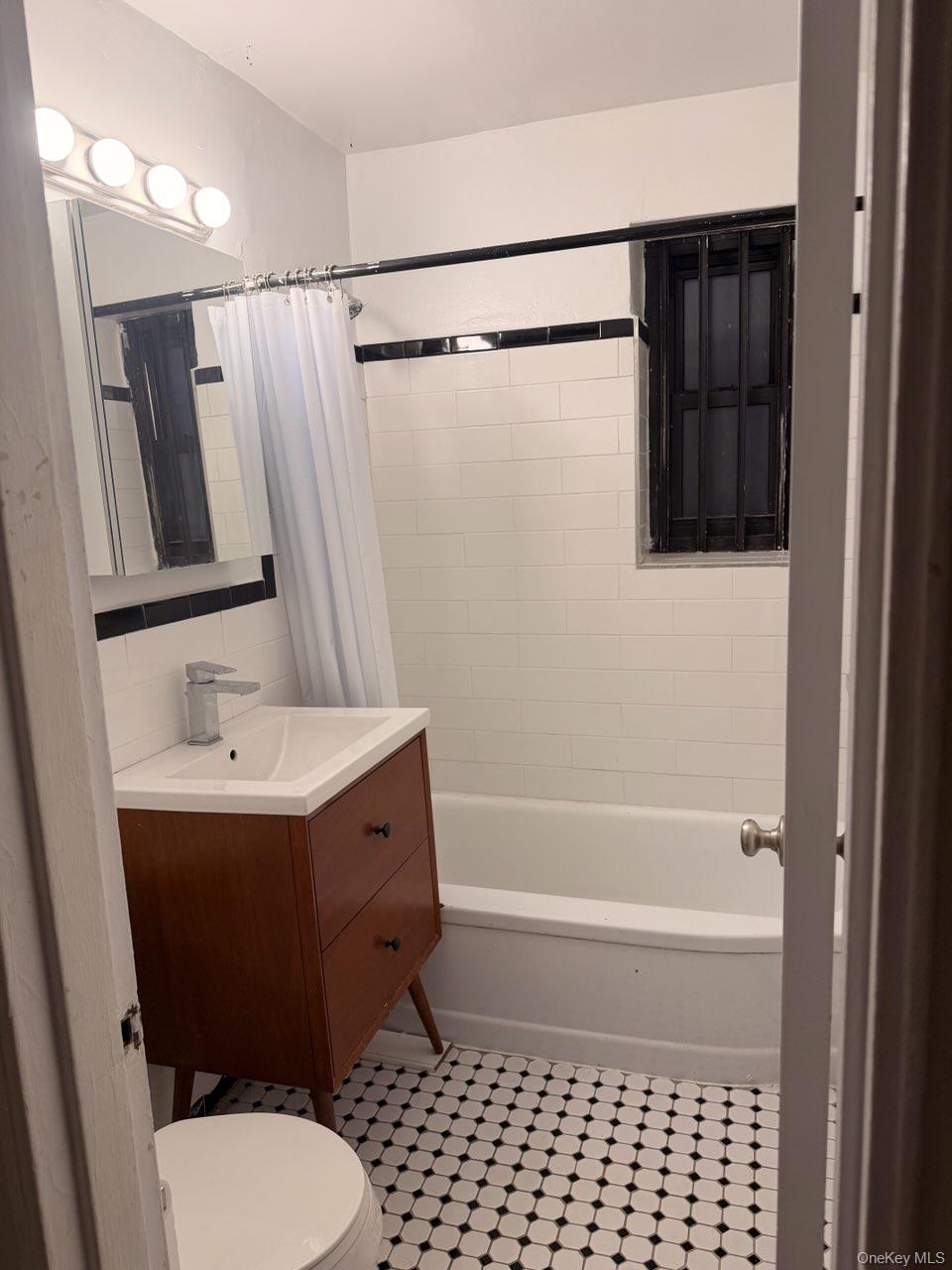 67-th Rd 10245th Queens, NY 11375 - Photo 2 of 6 a bathroom with a sink a toilet and shower
