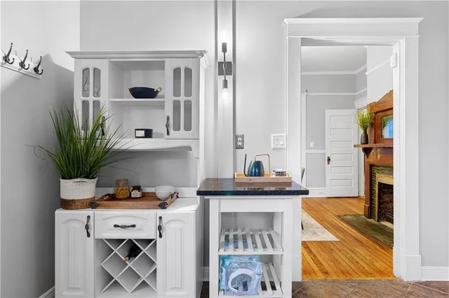 a living room with a sink and a potted plant