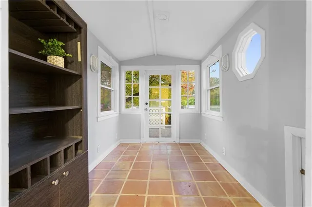 a view of an empty room with a window