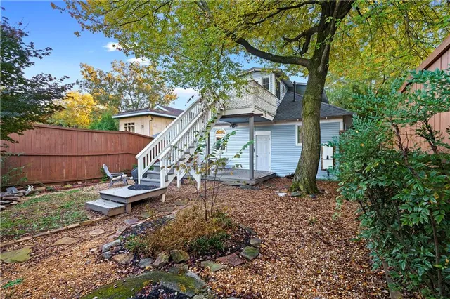 a backyard of a house with seating space