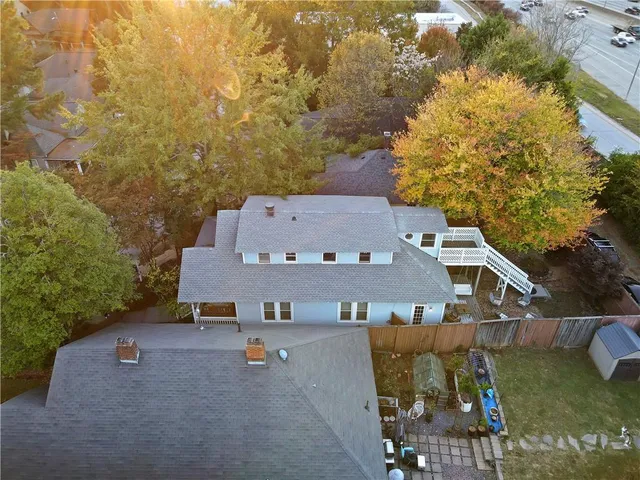 an aerial view of a house with a yard and garden