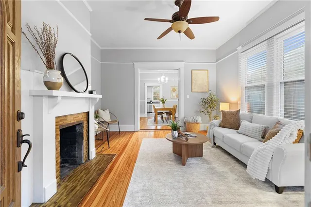 a living room with furniture and a fireplace