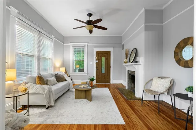 a living room with furniture and a fireplace