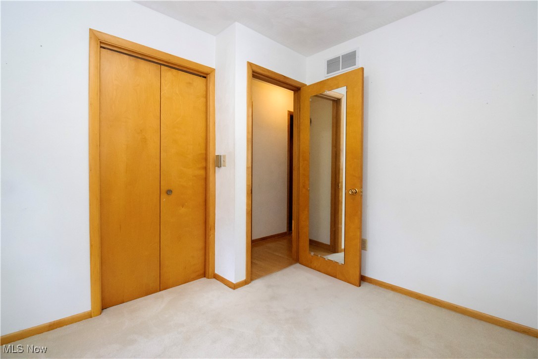 1675 South Funk Road Wooster, OH 44691 - Photo 20 of 34 Unfurnished bedroom with a closet and light colored carpet