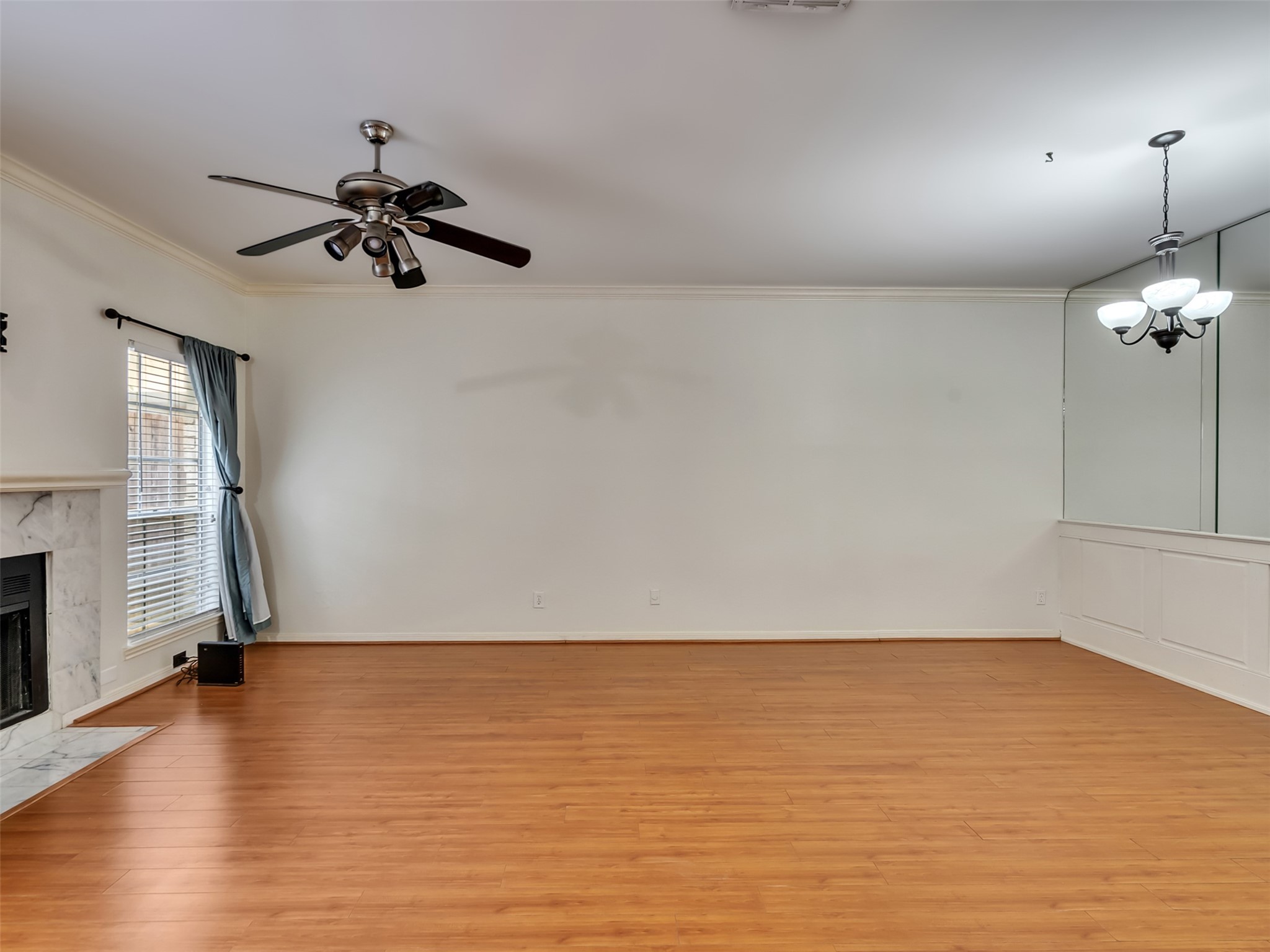 4001 Tanglewilde Street, Unit 605 Houston, TX 77063 - Photo 7 of 29 wooden floor in an empty room with a window