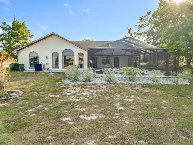 a view of a livingroom with furniture wooden floor chandelier