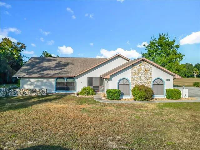 a view of a house with a yard