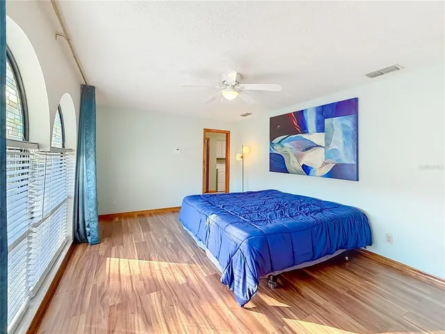 a bathroom with a sink vanity tub and a mirror