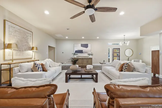a living room with furniture and a large window