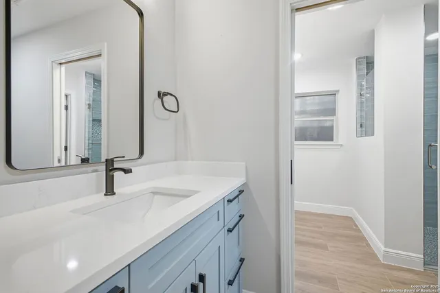 a bathroom with a sink and a mirror