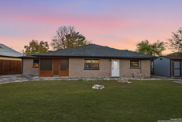 a house that has tree in front of it