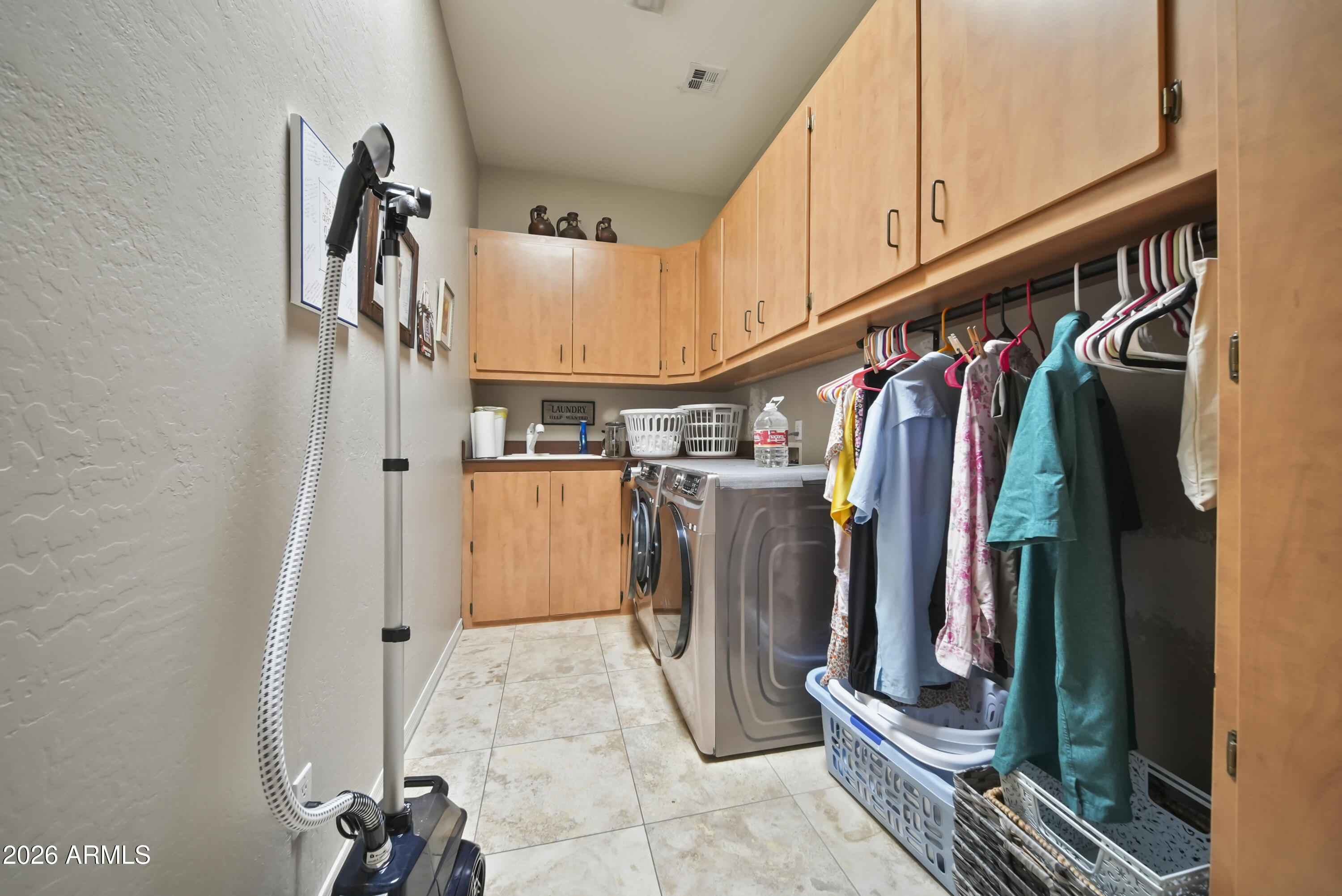 605 West Ridgecrest Road Phoenix, AZ 85086 - Photo 22 of 40 a view of walk in closet with clothes and shoes