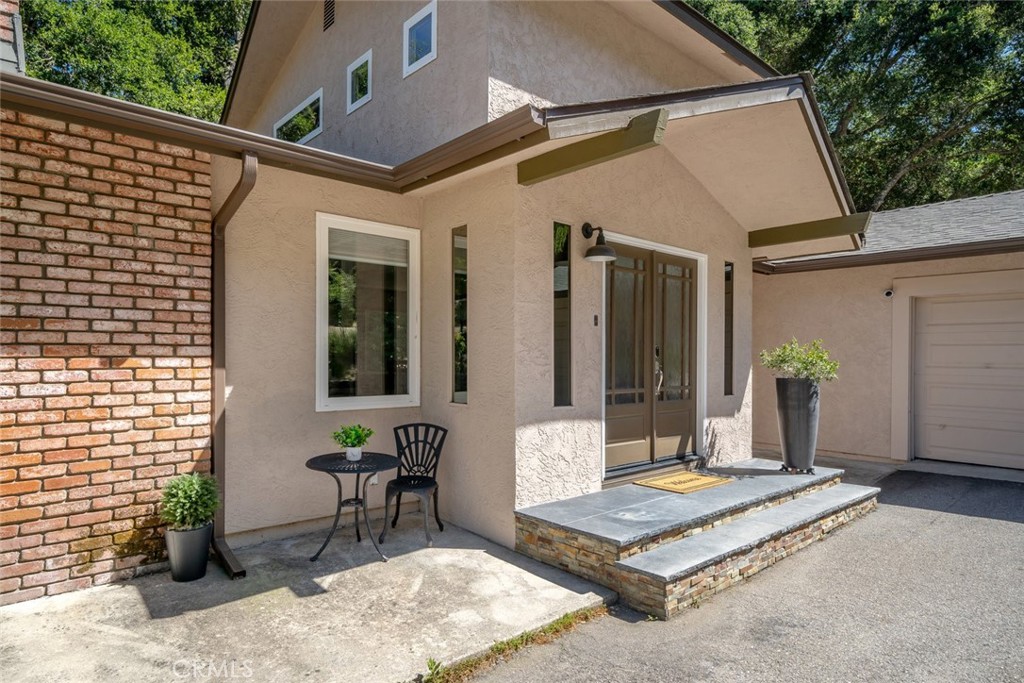 2025 Alturas Road Atascadero, CA 93422 - Photo 1 of 1 a building outdoor space with patio furniture and potted plants