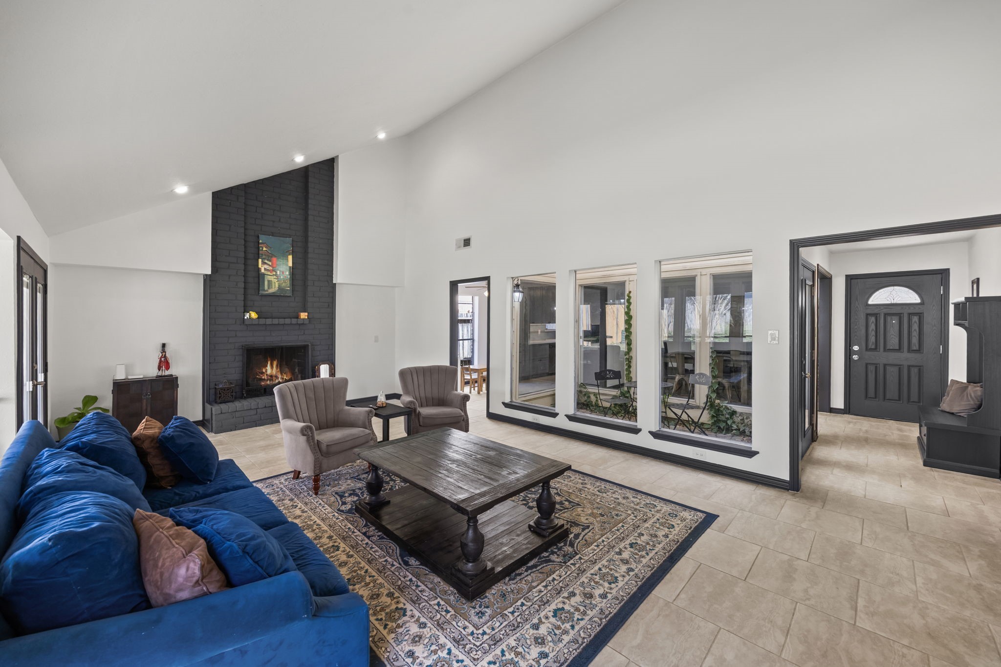 810 Hidden Canyon Road Katy, TX 77450 - Photo 18 of 33 This perspective highlights the family room’s open flow back toward the entry and dining area. Clean lines, tall ceilings, and thoughtful architectural details reinforce the home’s spacious and cohesive design.