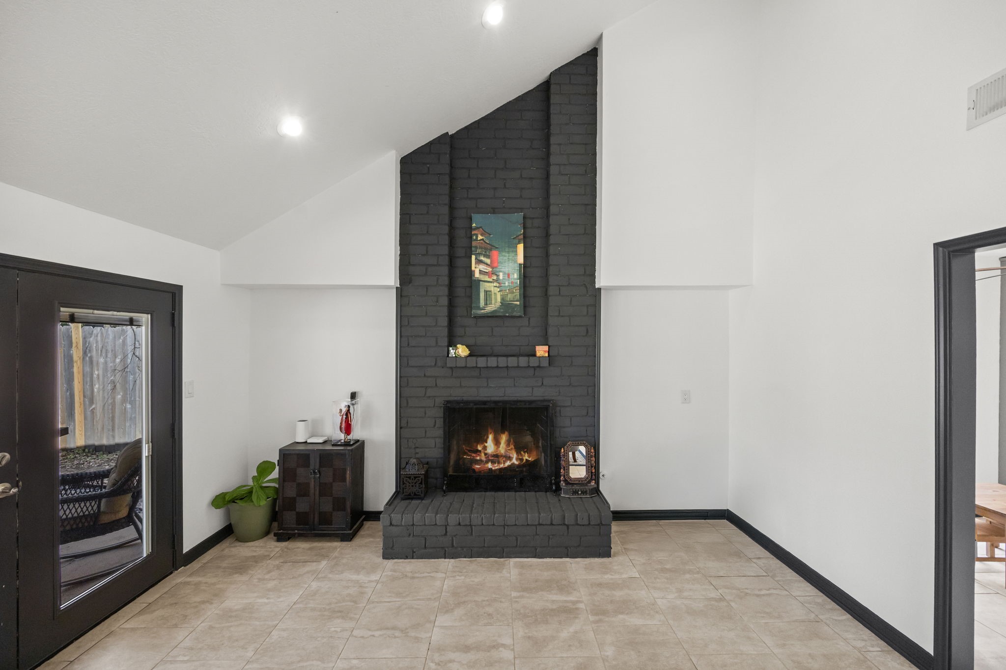 810 Hidden Canyon Road Katy, TX 77450 - Photo 19 of 33 A closer look at the striking brick fireplace reveals its bold texture and commanding presence. The centered design anchors the family room, offering both visual impact and a comfortable focal point for everyday living.