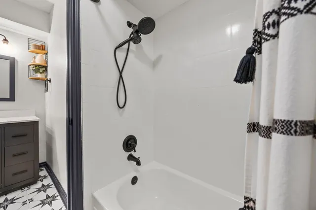 a view of a patio with table and chairs and potted plants