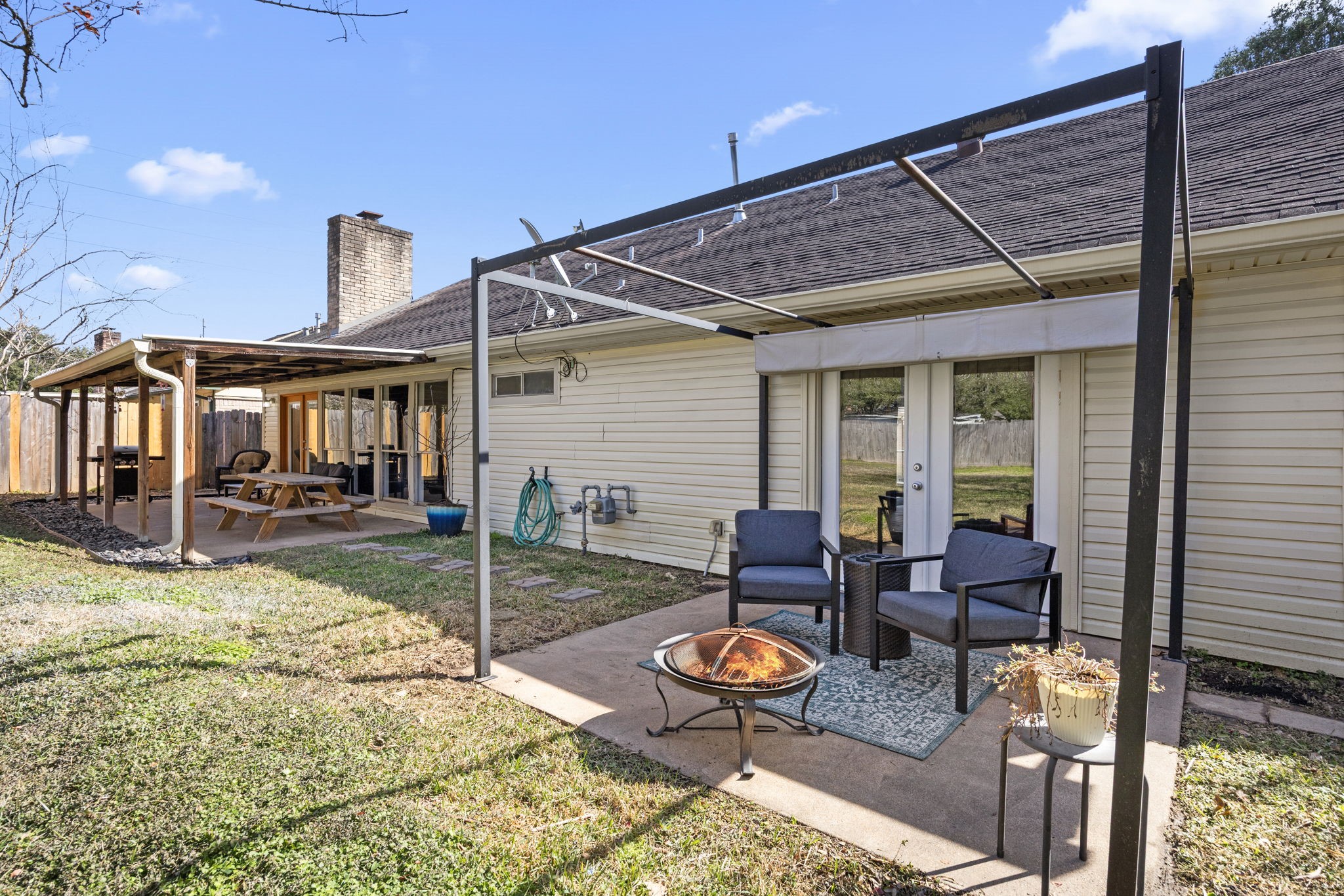 810 Hidden Canyon Road Katy, TX 77450 - Photo 30 of 33 A second cozy patio located off of the primary bedroom creates an inviting outdoor retreat, perfect for evening gatherings or quiet mornings.