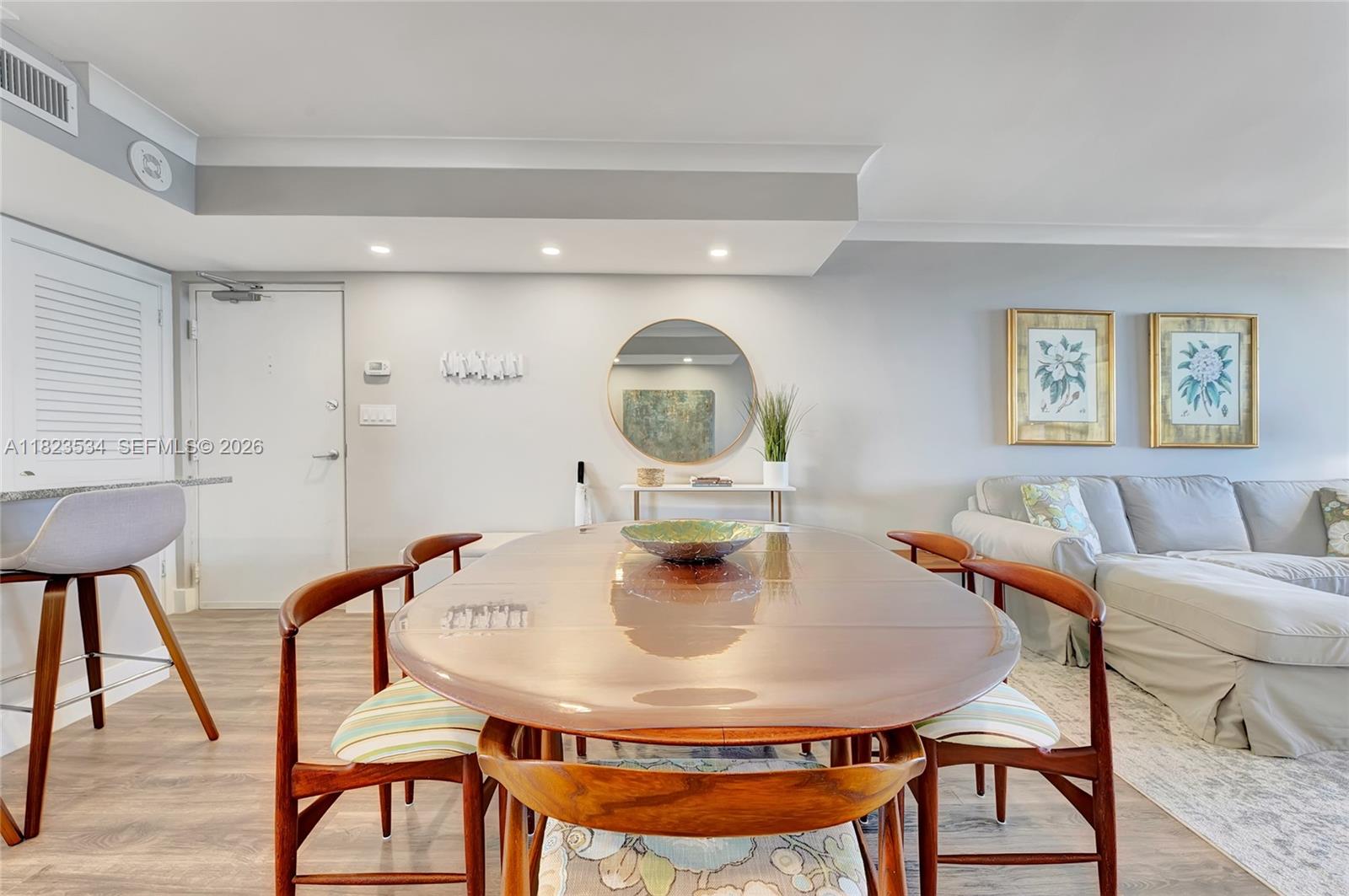 200 Ocean Trail Way, Unit 701 Jupiter, FL 33477 - Photo 20 of 40 a view of a dining room with furniture and wooden floor