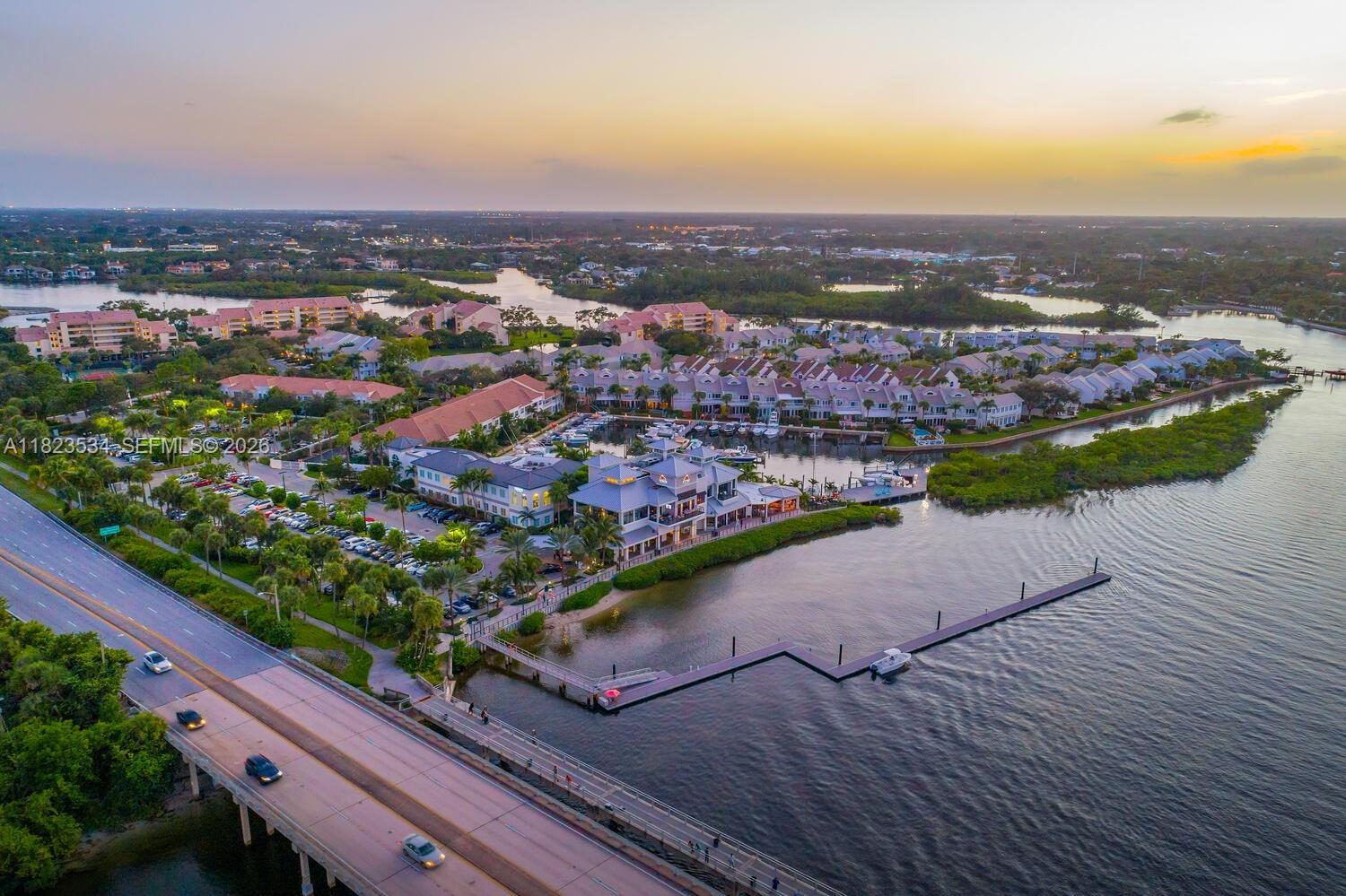 200 Ocean Trail Way, Unit 701 Jupiter, FL 33477 - Photo 35 of 40 an aerial view of residential houses with outdoor space and trees
