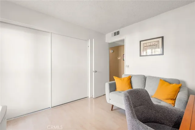 a bedroom with a bed and couch