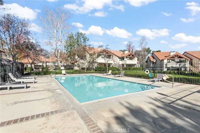 a view of a swimming pool with a lounge chairs