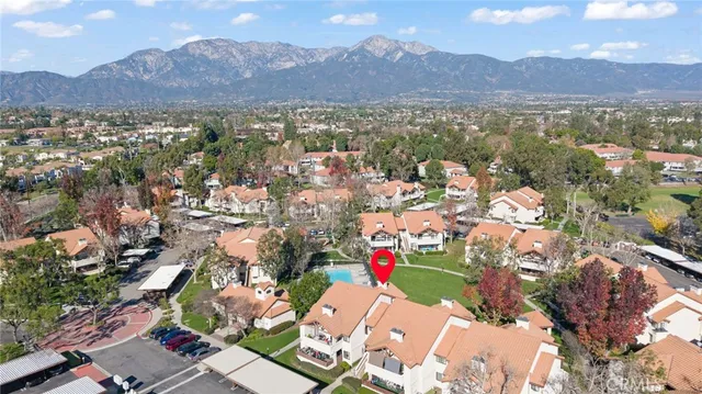 an aerial view of residential houses with outdoor space