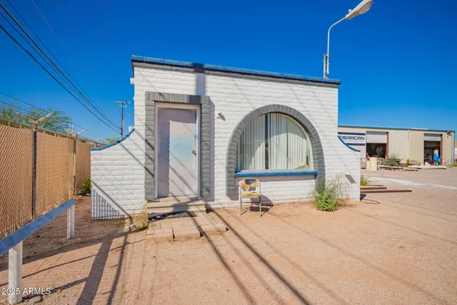 a kitchen with a sink white cabinets and appliances
