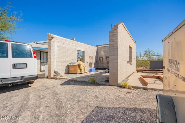 a kitchen with furniture and a refrigerator