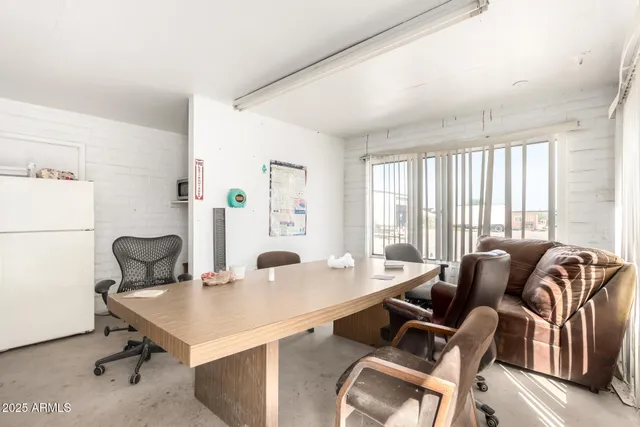 a view of workspace with furniture and cabinet