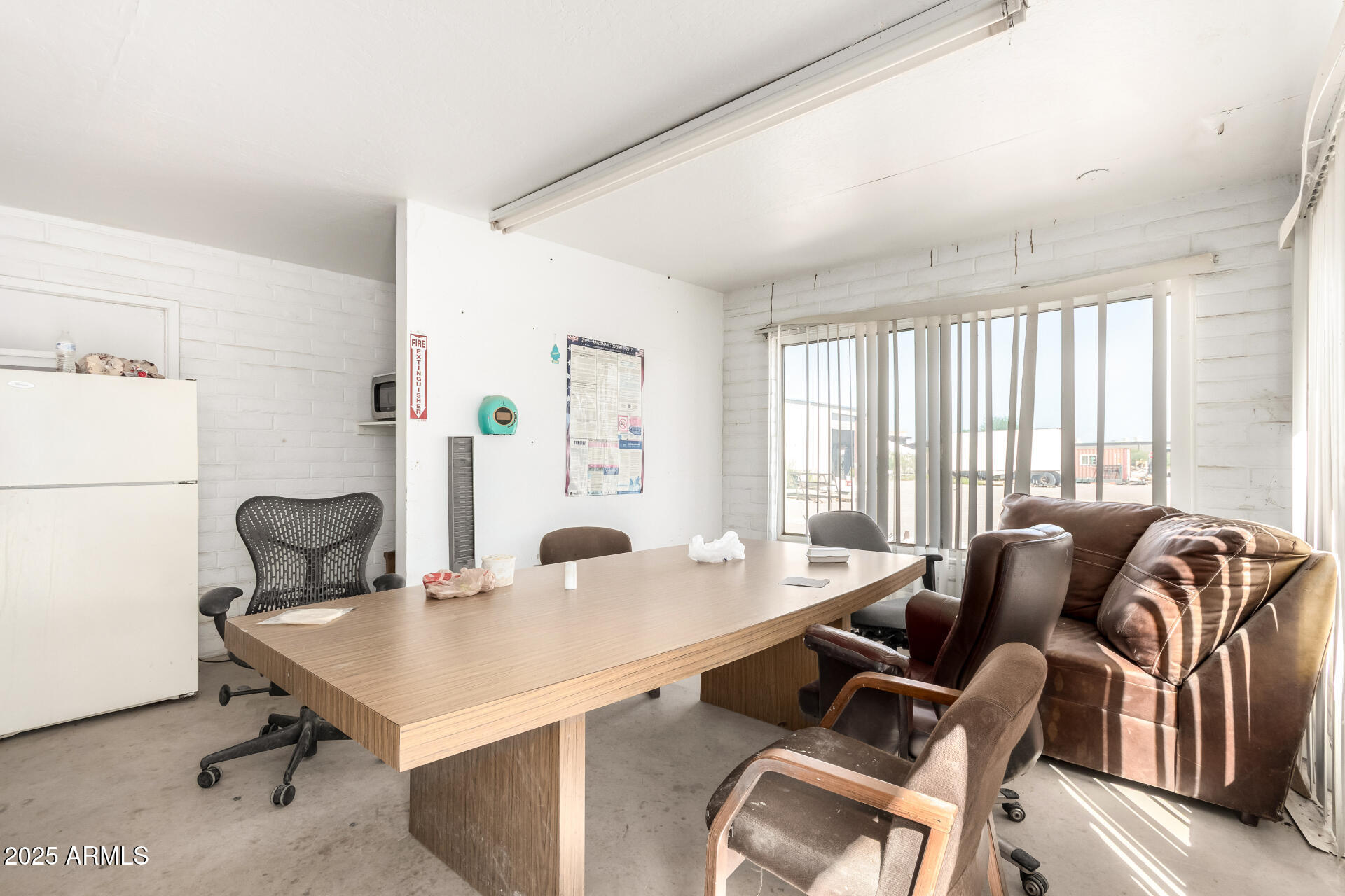 2925 East Ganley Road, Unit 121 Tucson, AZ 85706 - Photo 24 of 45 a view of a workspace with furniture and a window