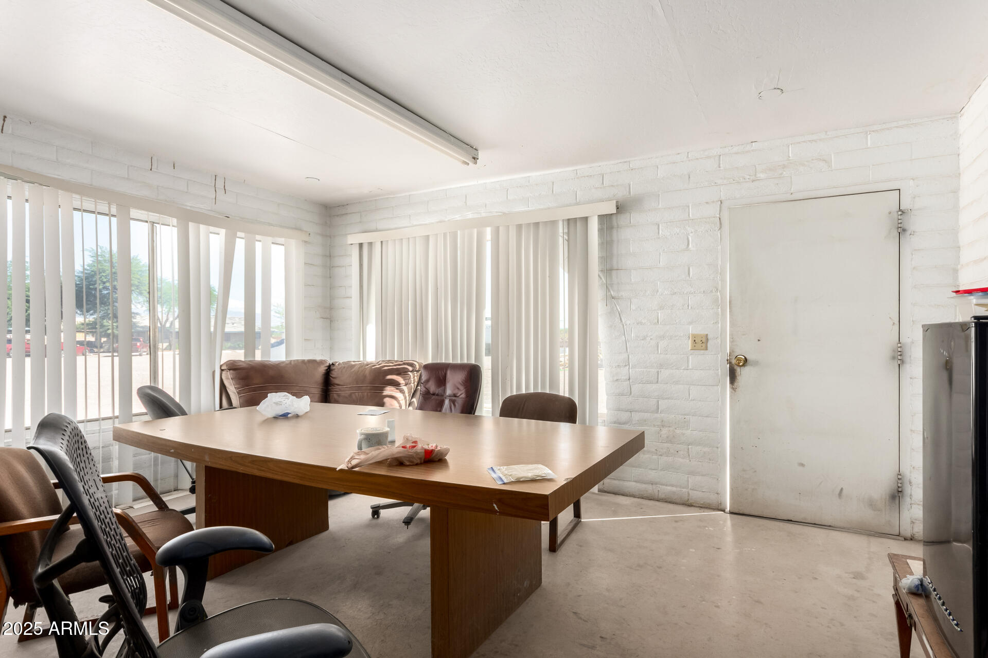 2925 East Ganley Road, Unit 121 Tucson, AZ 85706 - Photo 25 of 45 a view of a dining room with furniture window and outside view