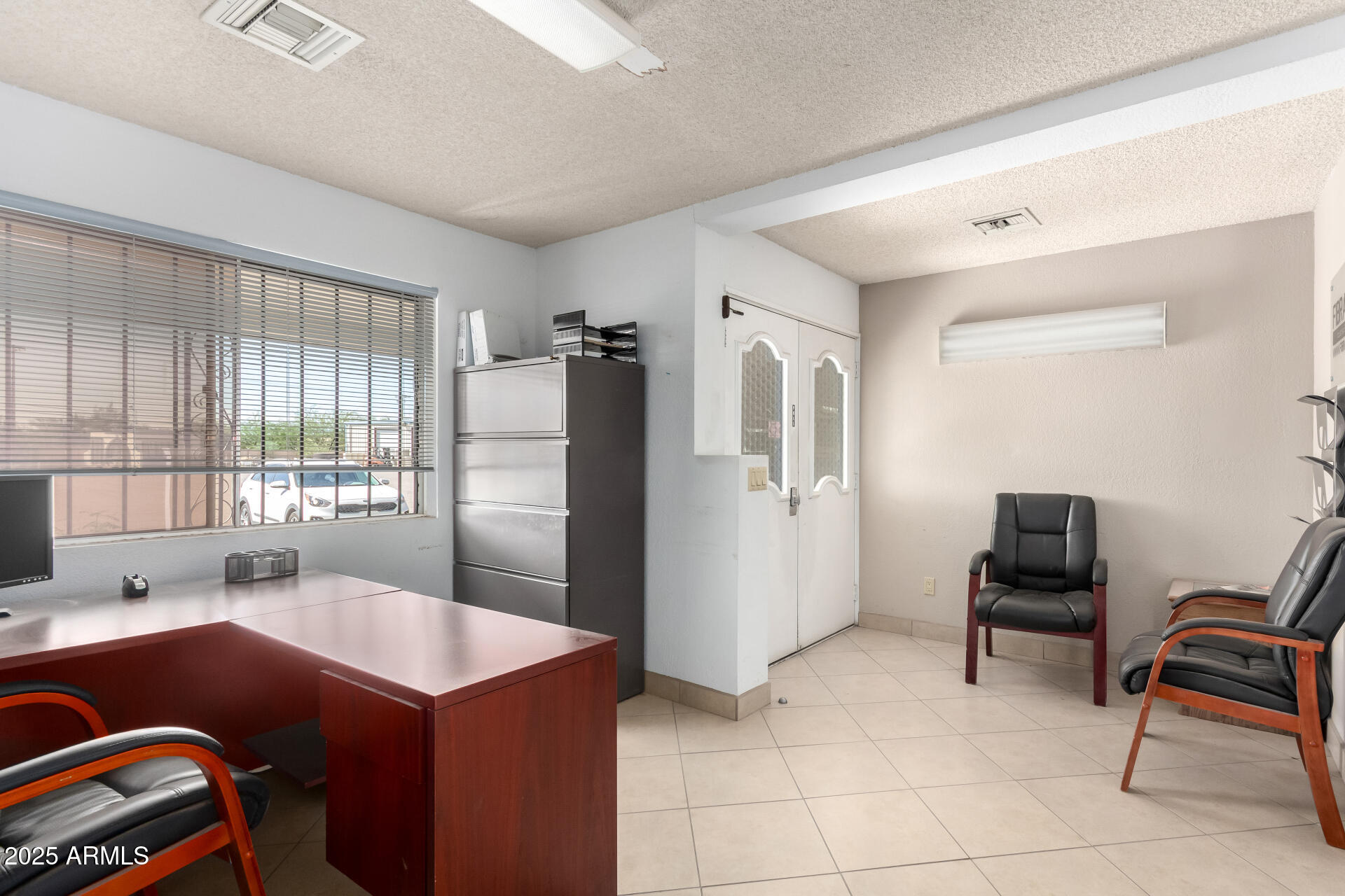 2925 East Ganley Road, Unit 121 Tucson, AZ 85706 - Photo 28 of 45 a kitchen with furniture and a refrigerator