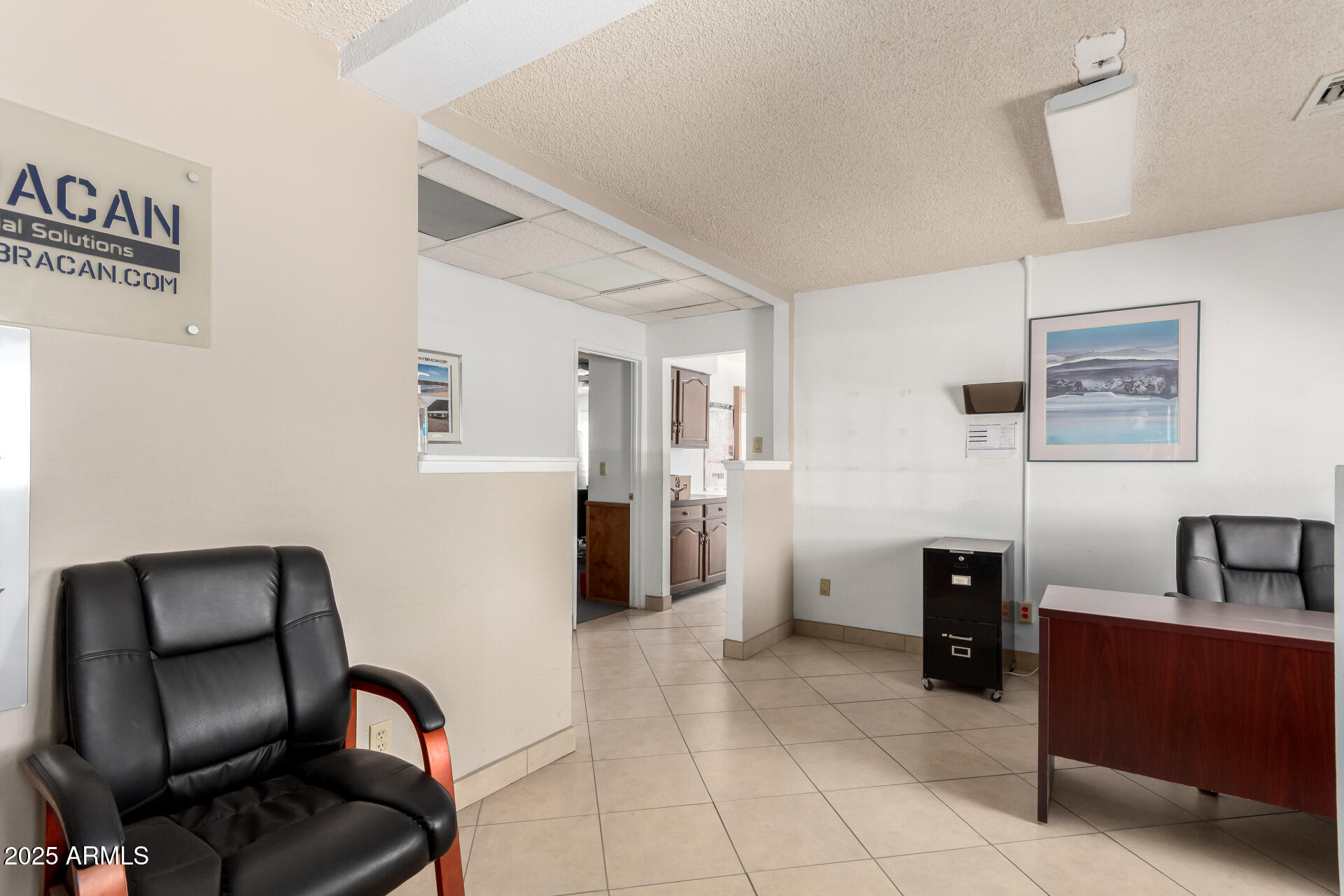 2925 East Ganley Road, Unit 121 Tucson, AZ 85706 - Photo 29 of 45 a view of workspace with furniture and cabinet