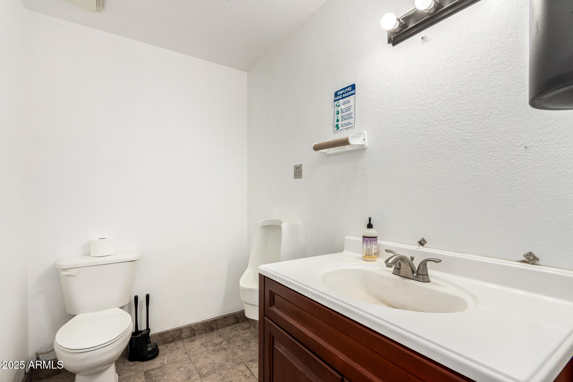 2925 East Ganley Road, Unit 121 Tucson, AZ 85706 - Photo 31 of 45 a bathroom with a sink toilet and a mirror