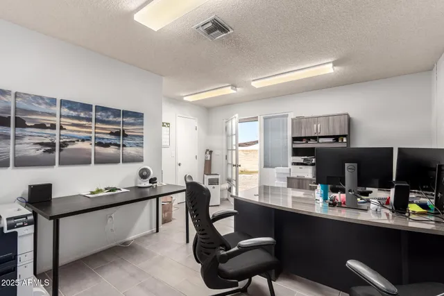 a kitchen with a sink a stove and cabinets