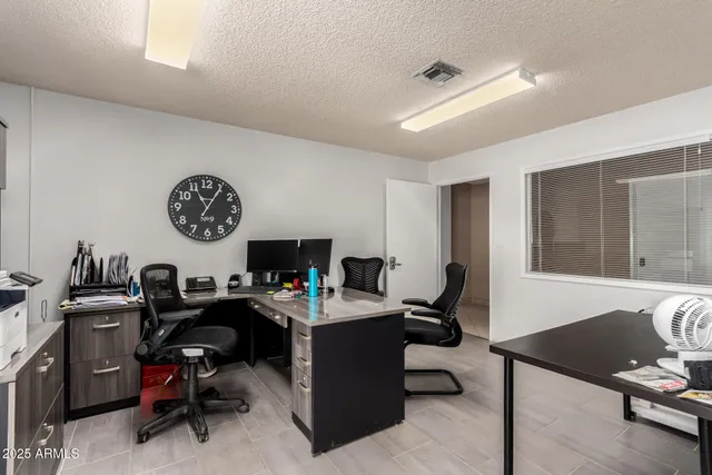 a backyard of a house with seating space